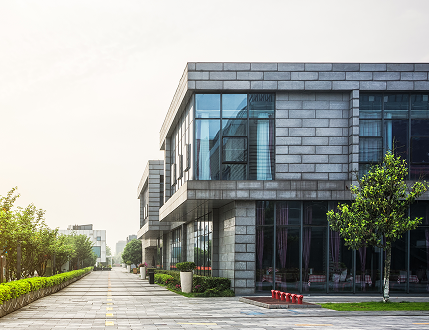 empty-footpath-with-modern-office-building-exterior-blue-cloudy-sky-sunrise 2